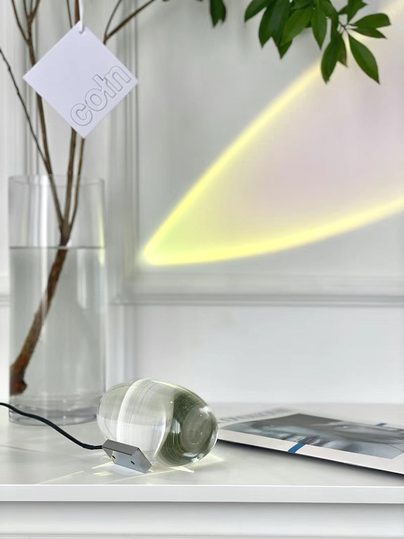 Sunset projection lamp casting realistic sunset colours in bedroom.
