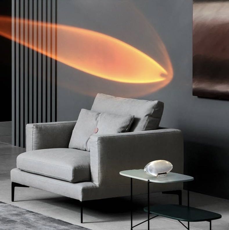 Sunset lamp adding soft warm light for romantic bedroom ambiance.
